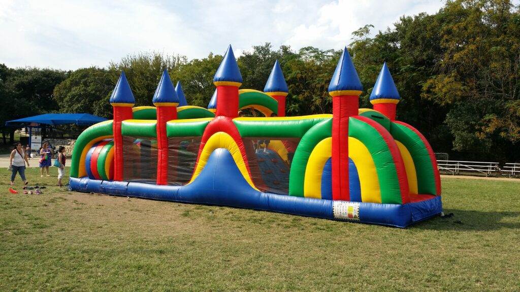 40′ castle obstacle course rental at an event