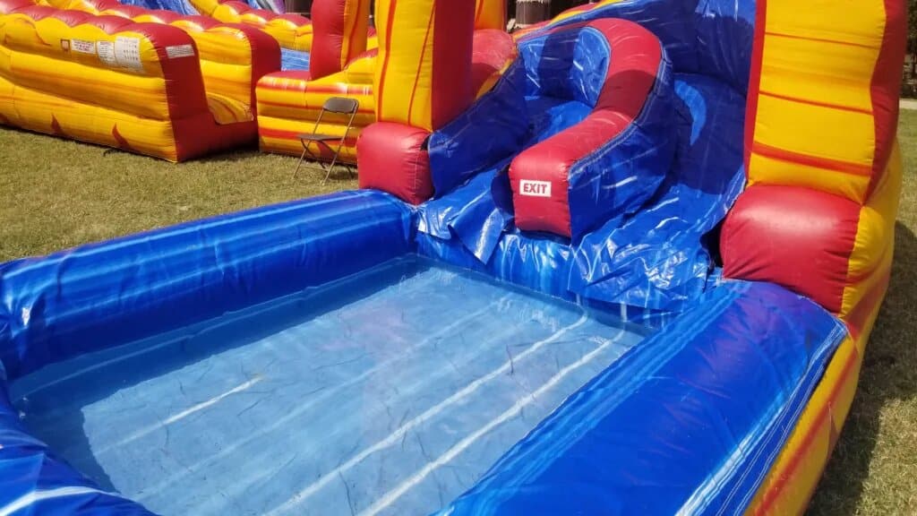 27 Foot Lava Twist Water Slide (50’L X 30’W X 27’H) rental photo