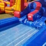 27 Foot Lava Twist Water Slide (50’L X 30’W X 27’H) rental thumbnail 1