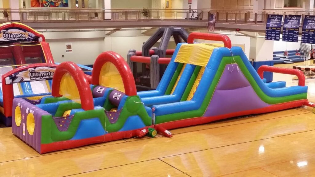 60′ Wacky Millenium obstacle course rental at an event