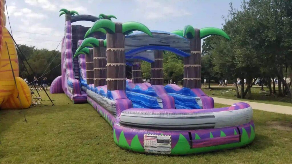 27 Foot Royal Purple Water Slide (65’L X 20’W X 27’H) rental at an event