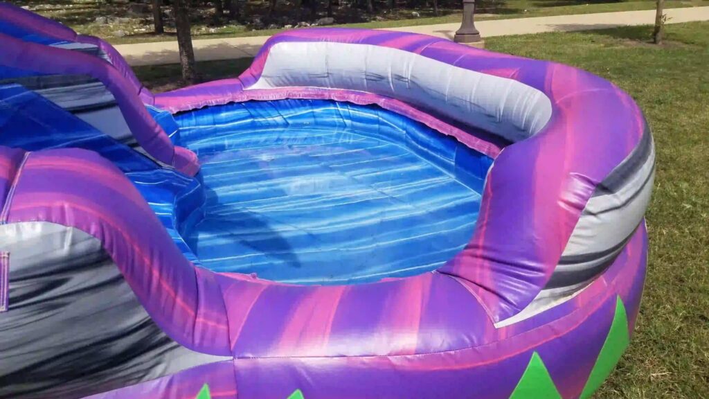 27 Foot Royal Purple Water Slide (65’L X 20’W X 27’H) rental at an event