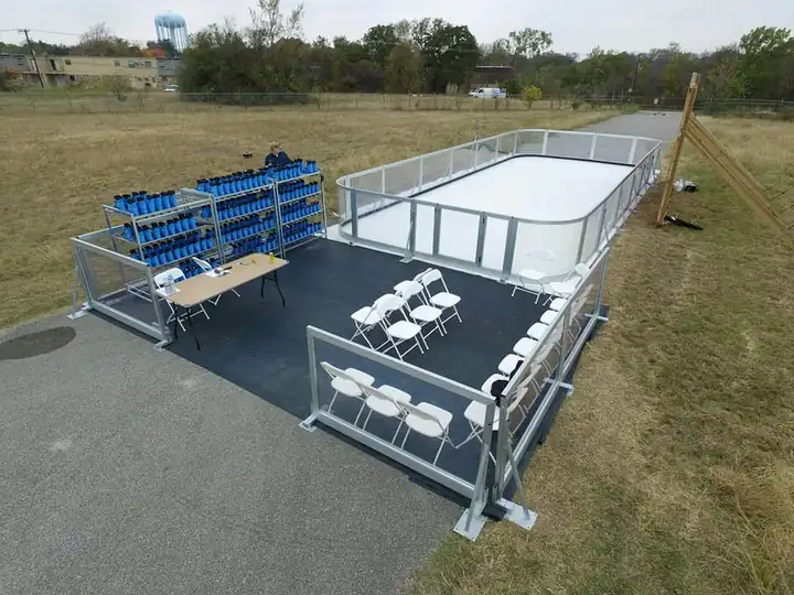 Aerial view of a compact Amanzi synthetic ice rink and skate-changing area